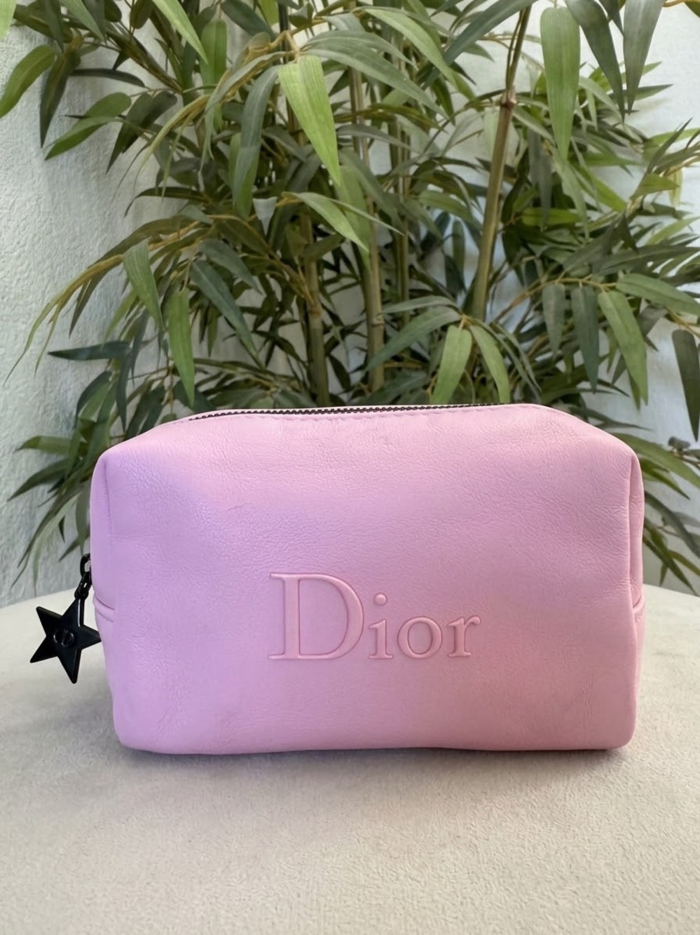 Dior Beauté Pink Cosmetic Pouch featuring an embossed logo and a signature star